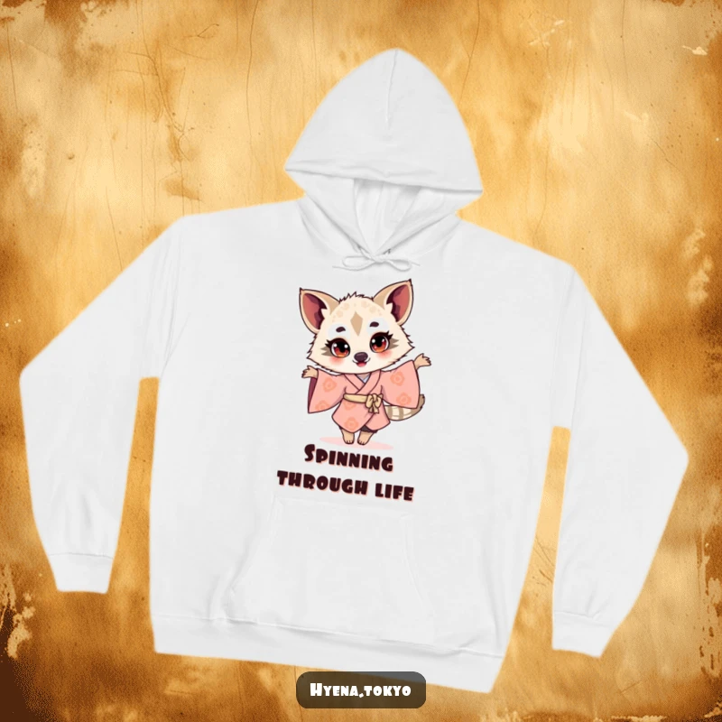 Funny hyena illustration in a kimono, twirling with bright eyes, depicted on a cozy hoodie for cheerful and humorous wear.